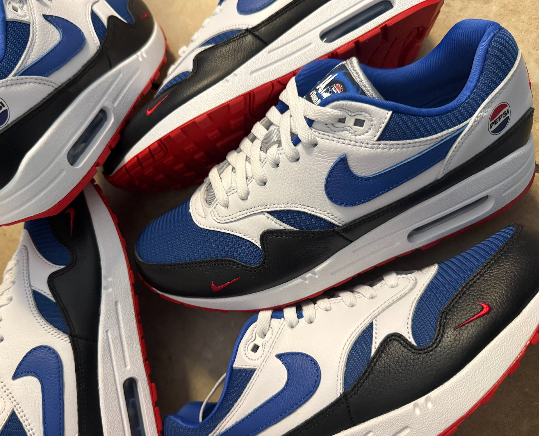 Blue, red, and black custom sneakers made for Pepsi
